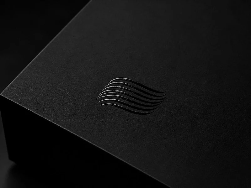 A matte black box lid where only the Celiform mark is glossy