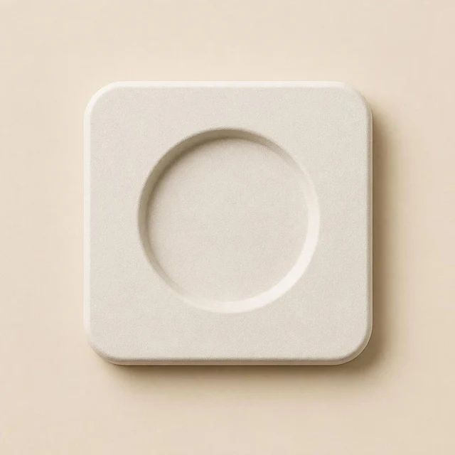 The front face of a white fibre insert with a round cavity: smooth