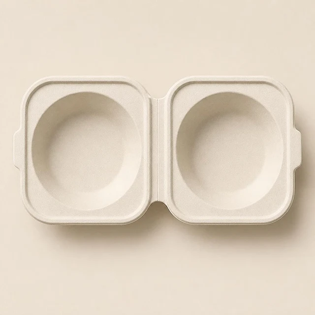 A white fibre clamshell opened flat, smooth inside and out